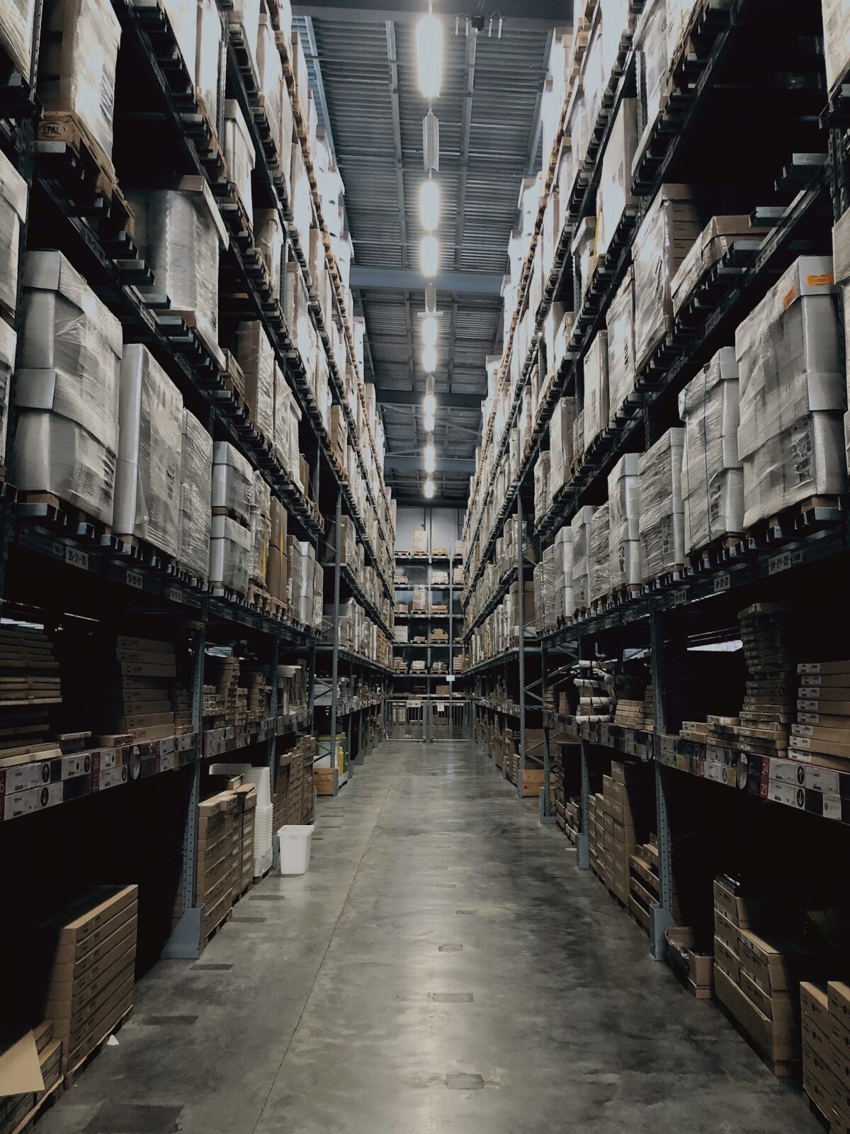 A warehouse aisle between tall racking.